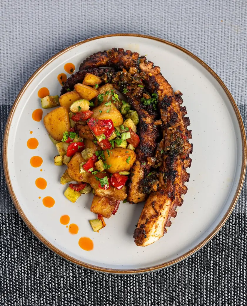 Grilled octopus with roasted potato and pepper salsa