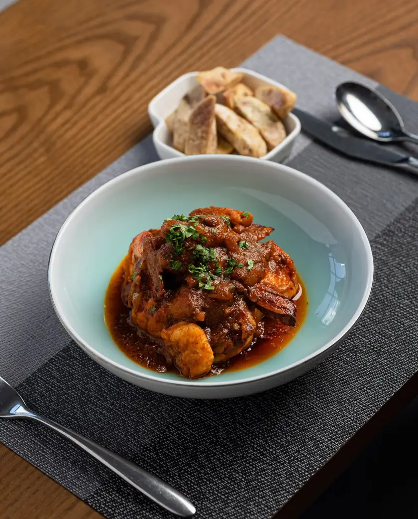 Prawns in a rich tomato sauce with toasted bread